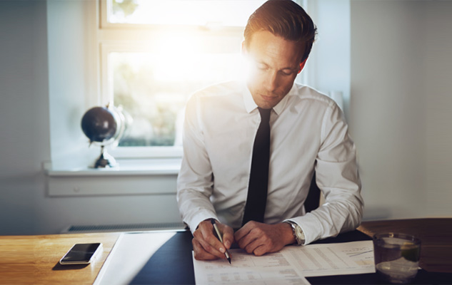  A paralegal who is intently at work on his desk