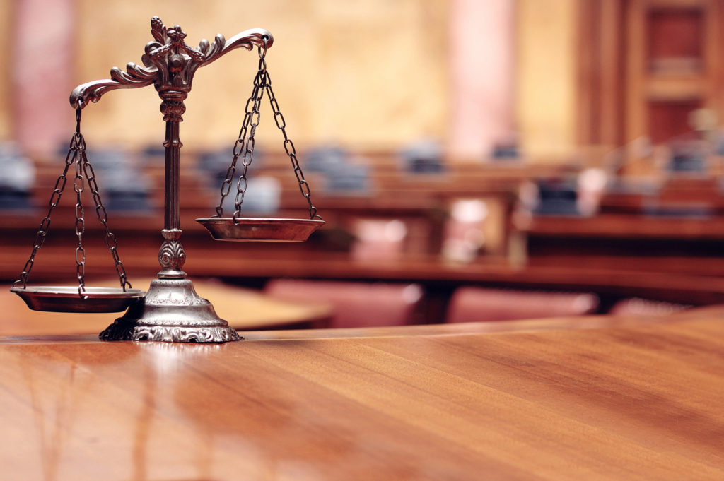 Close up of legal scales in a courtroom