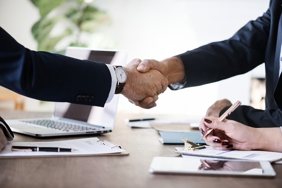 Close up of two men shaking hands