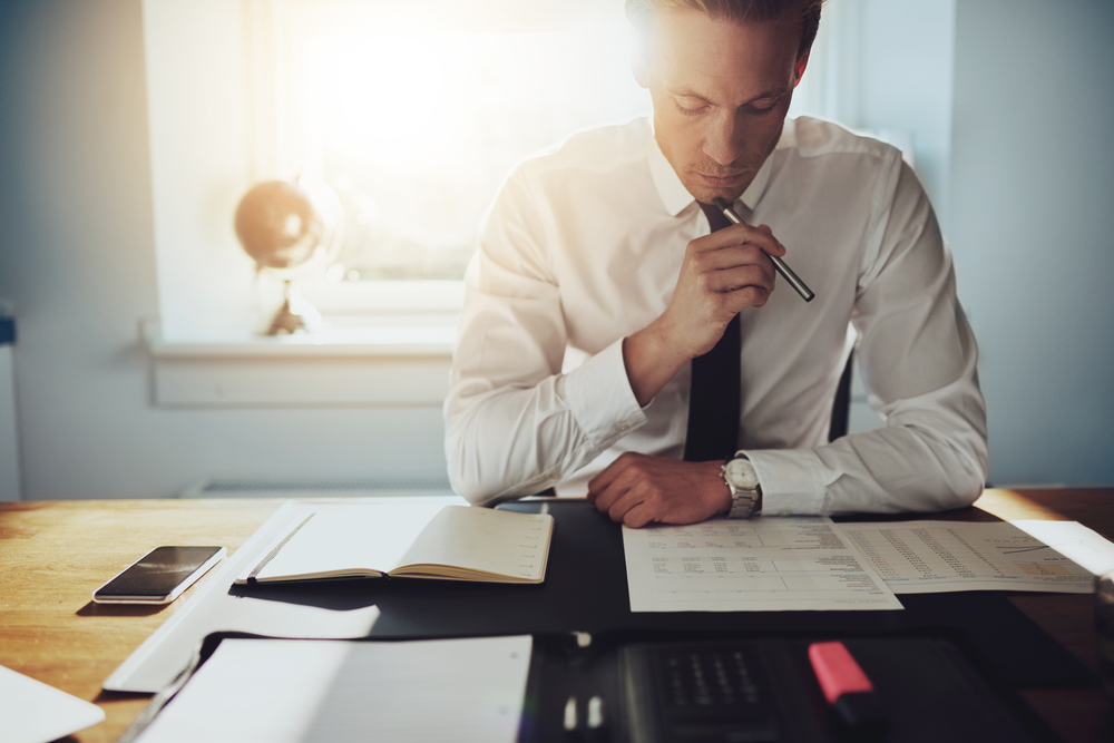 Man looking over paralegal program materials in toronto