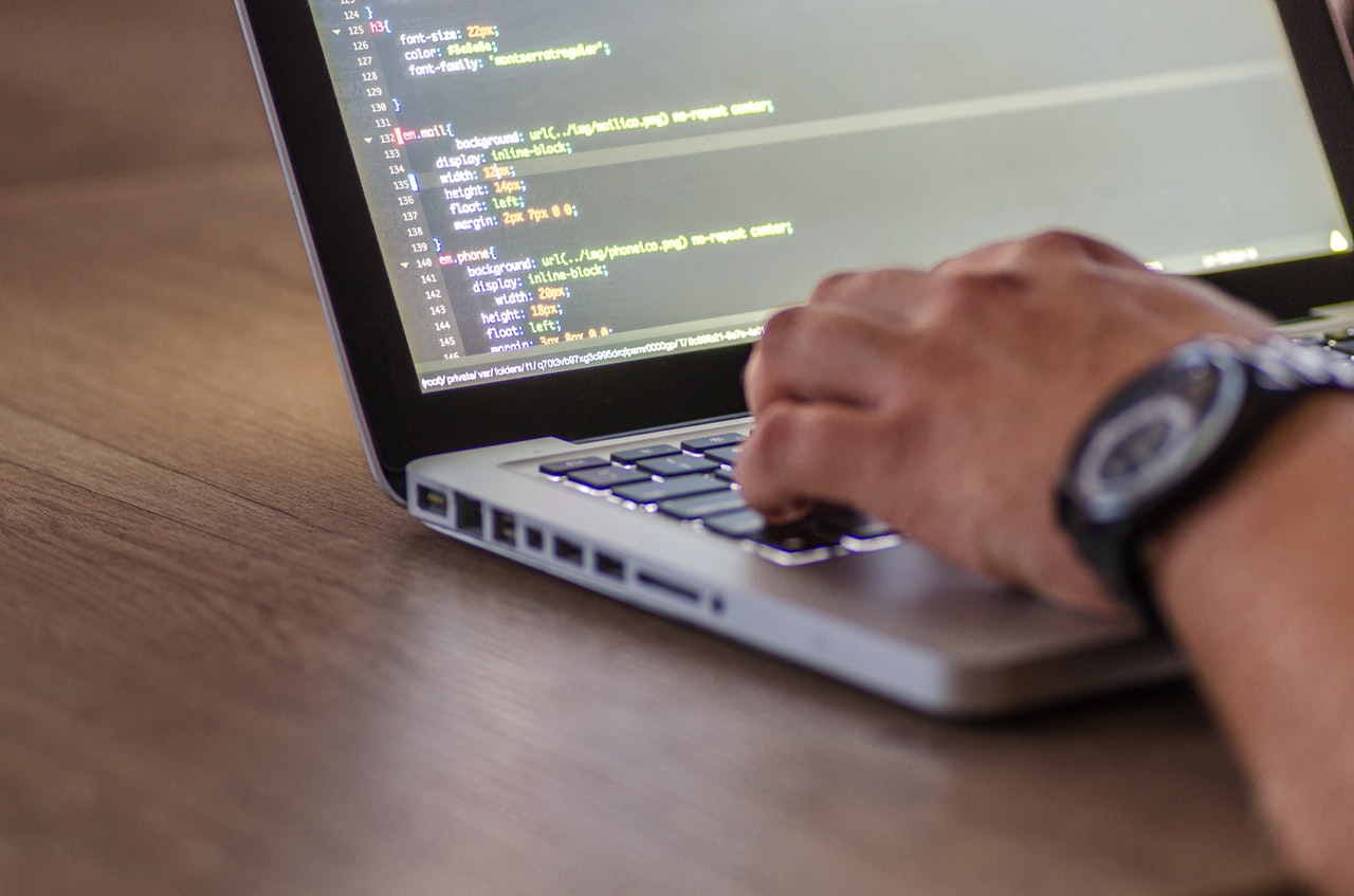 A man studying a mobile app development course in Toronto