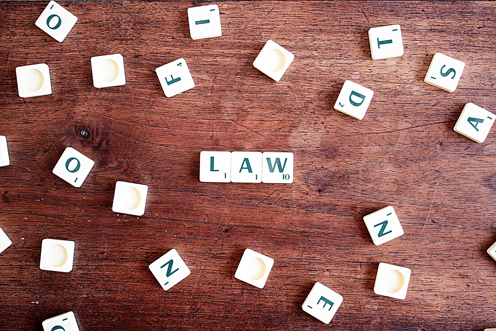 Close up of scrabble tiles spelling out the word ‘law’