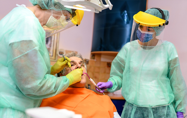Dental assistants looking at x-rays