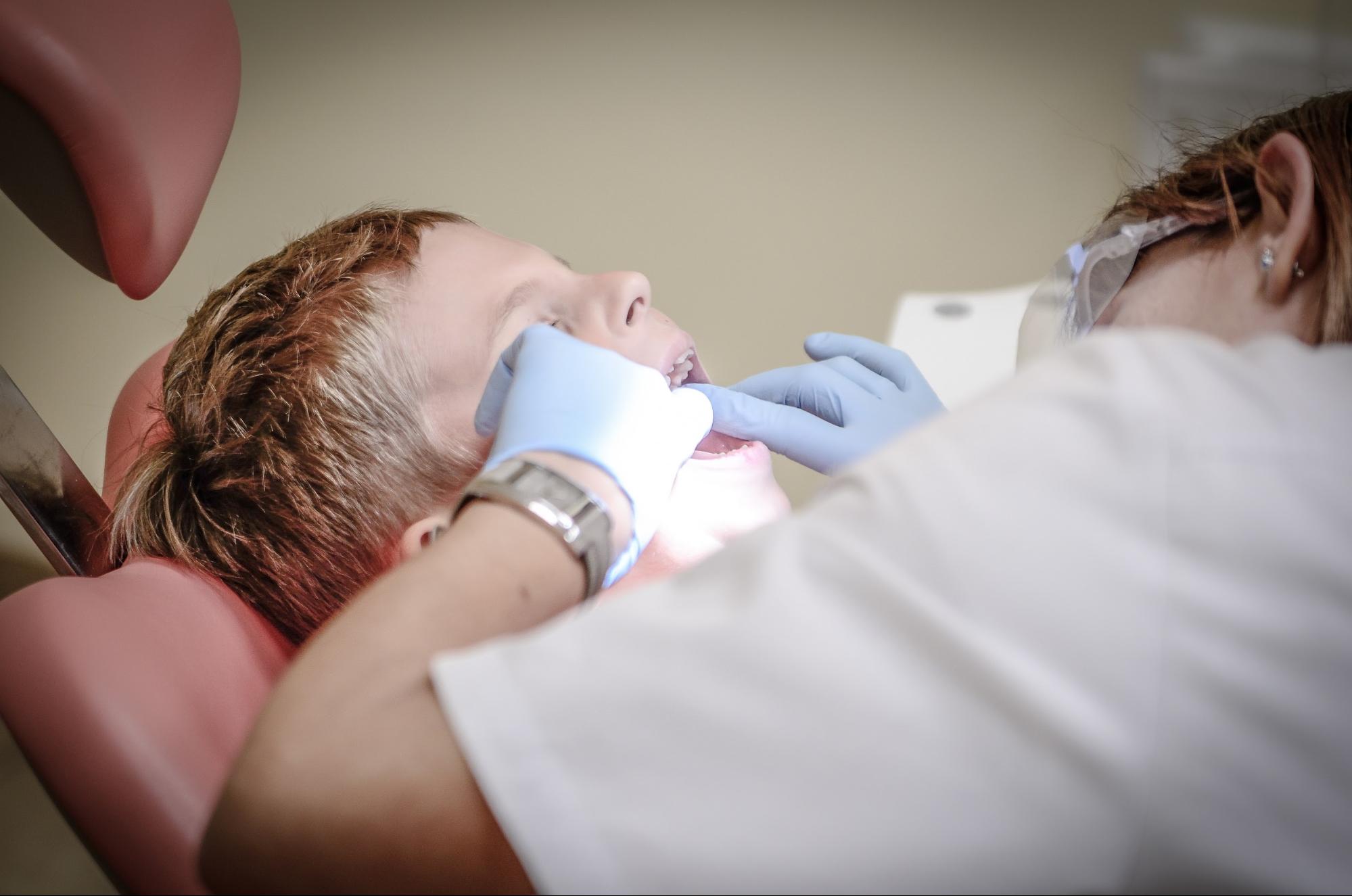Close up of a child receiving dental work