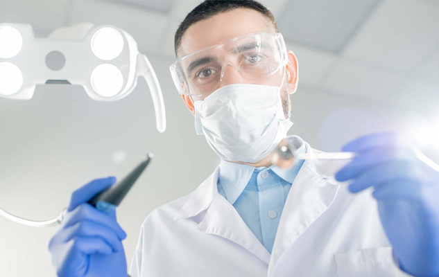 Dentist and dental assistant taking an x-ray