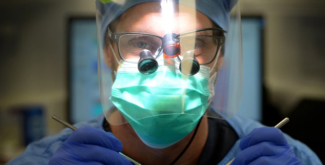 assistant walks the halls of a hospital