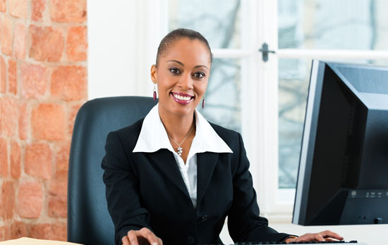 Paralegal doing legal research at his desk