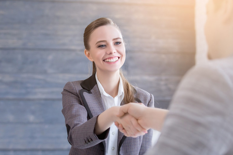 Applicant for a paralegal job arriving at the interview with a smile