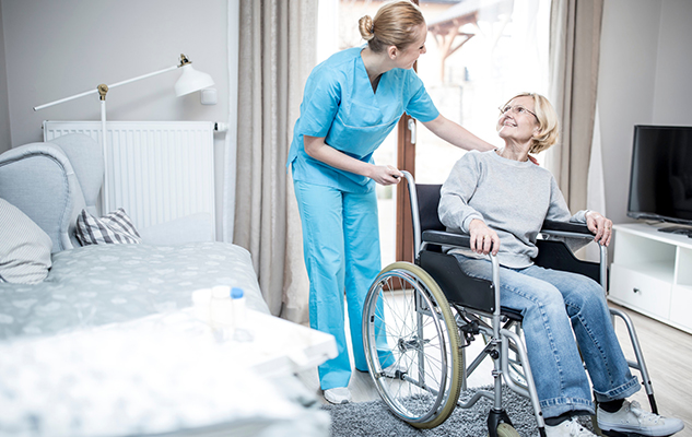 A PSW assists a disabled woman in her home