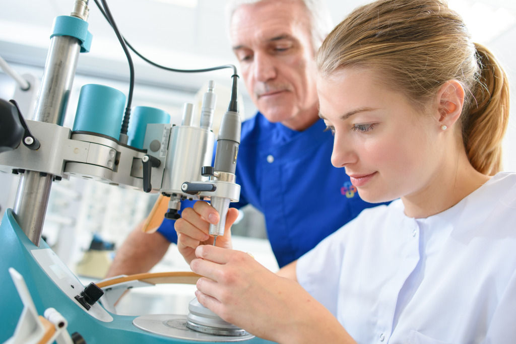 a person and person working on a machine